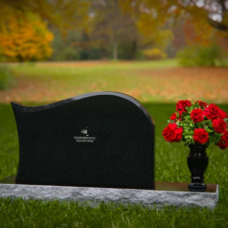 Modern waved granite headstones with flower vase for peaceful tribute.
