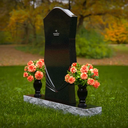 Elegant headstones with unique contours and dual flower vases.
