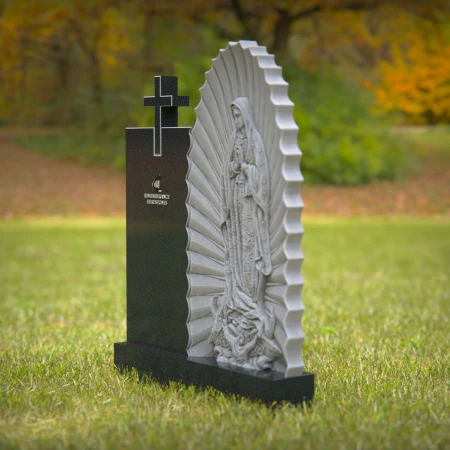 Religious headstones featuring Virgin Mary and cross for sacred memorials.