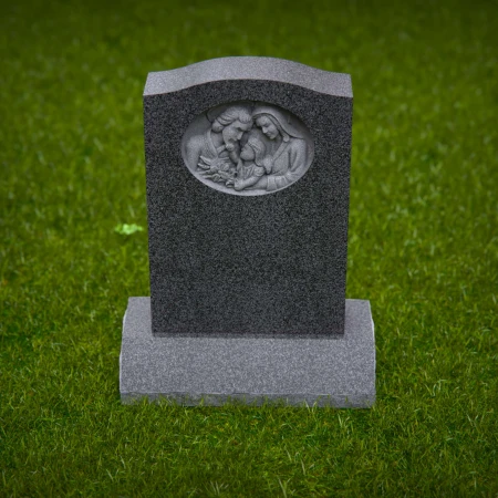 1917 - Upright Monument with Family Relief Carving in Peaceful Setting