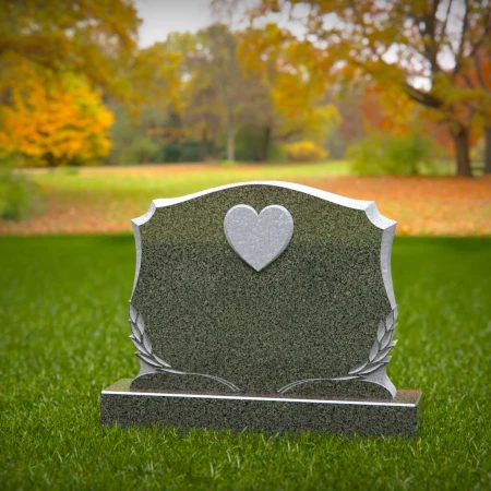 Memorial artistry flows through heart and leaf designs in headstones