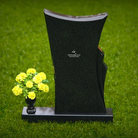 Contemporary granite memorial headstones with unique curved design.