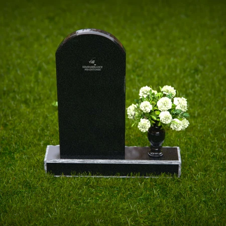 Classic arched headstones with a single flower vase for tribute.