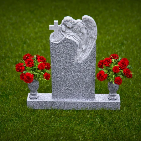 1911 - Angel Monument Embracing Cross with Floral Tributes