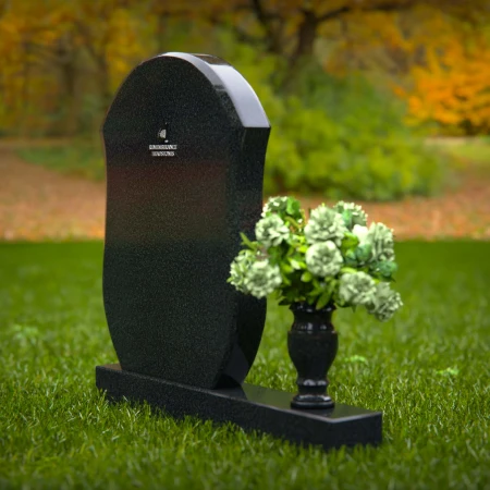 Unique granite headstones with rounded shield design and flower vase.