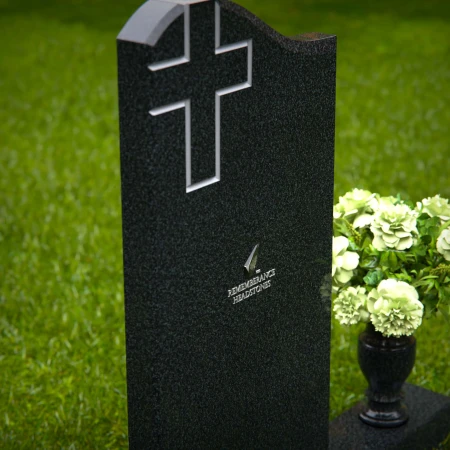Granite headstones featuring a cross design and flower vase.
