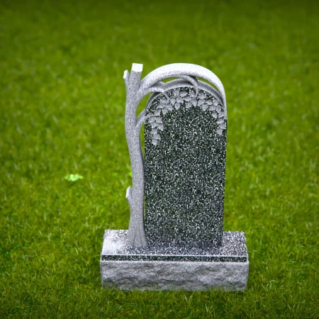 The sheltering arch over a life-giving tree defines these tombstones