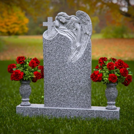 1911 - Angel Monument Embracing Cross with Floral Tributes