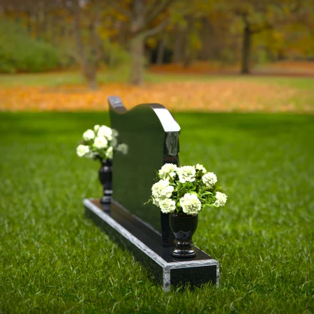 Elegant curved headstones with artistic detailing for a timeless tribute.