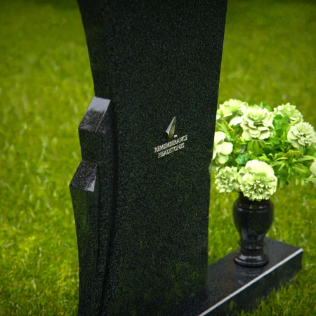 Contemporary headstones featuring a flowing design and floral vase.