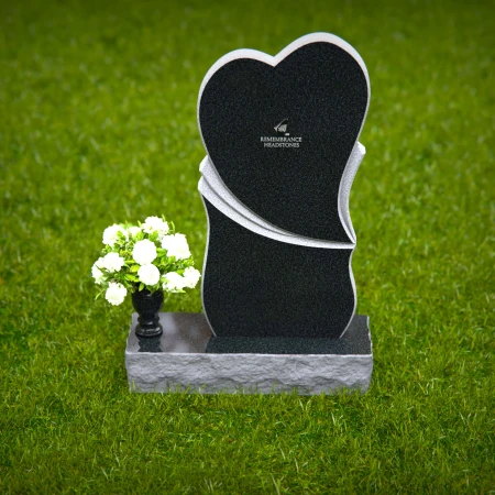Modern heart-shaped granite headstones with elegant layered design.