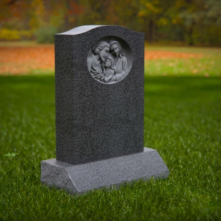 1917 - Upright Monument with Family Relief Carving in Peaceful Setting
