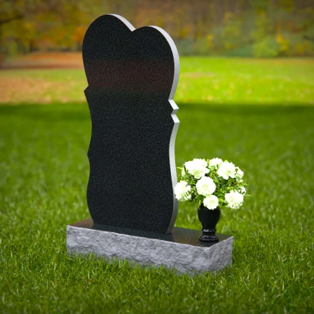 Modern heart-shaped granite headstones with elegant layered design.