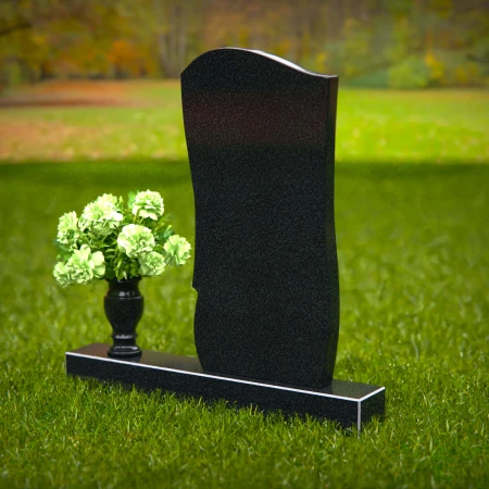 Elegant curved granite headstones with layered detailing for timeless memorials.