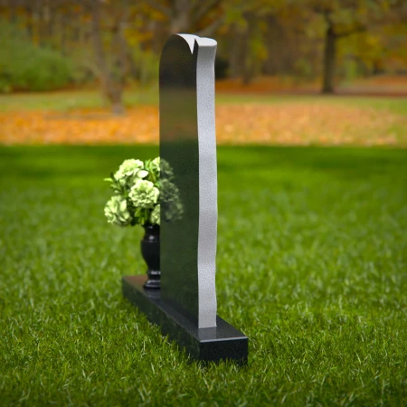 Elegant headstones featuring a tree design symbolizing growth and life.