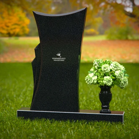 Contemporary headstones featuring a flowing design and floral vase.