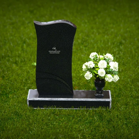 Modern curved granite headstones with engraved detailing for tribute.