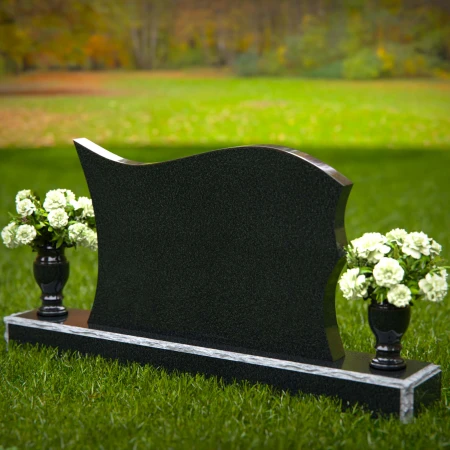 Elegant curved headstones with artistic detailing for a timeless tribute.