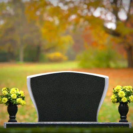 Elegant double vase headstones with contoured design for tribute.