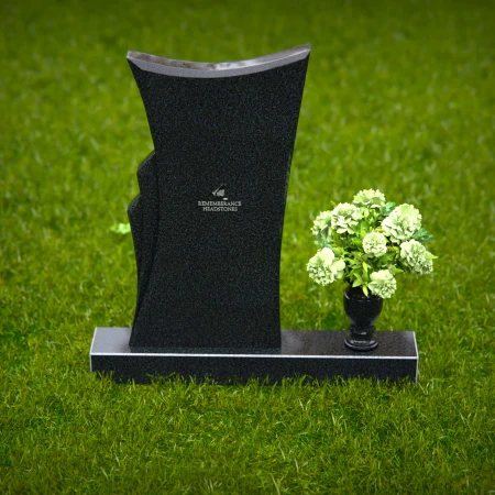 Contemporary headstones featuring a flowing design and floral vase.