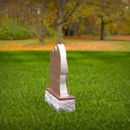 Graceful presence keeps memory alive through memorials, headstone, and grave ornaments.