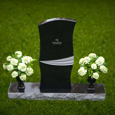 Elegant curved granite headstones with a timeless memorial design.