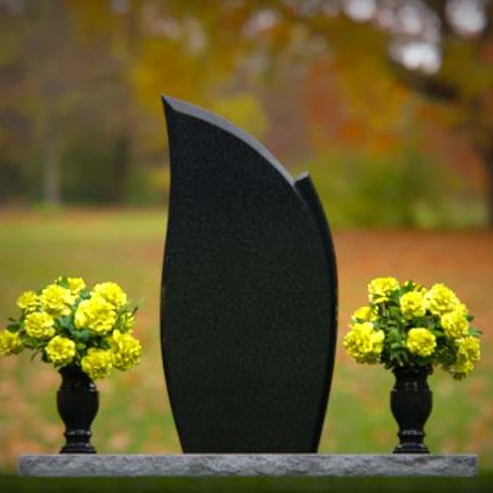 Elegant asymmetrical granite headstones crafted as unique memorial tributes.