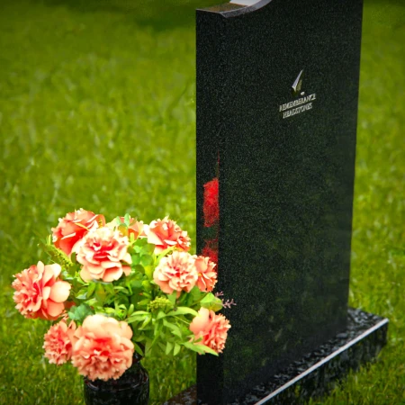 Curved granite headstones with elegant flower vase tribute.