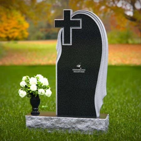 Graceful asymmetrical granite headstones with cross, symbolizing faith and remembrance.