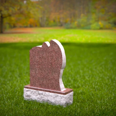 Graceful presence keeps memory alive through memorials, headstone, and grave ornaments.
