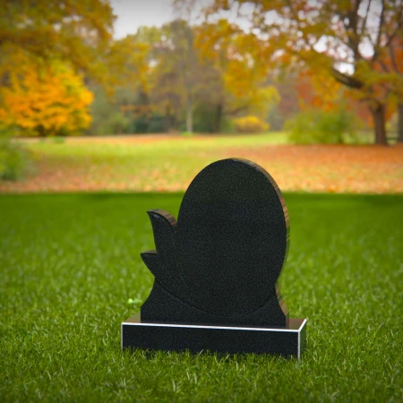 oval silhouette headstone etched with graceful leaves for headstone prices