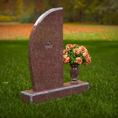 Contemporary headstones featuring sleek curves and floral vases.
