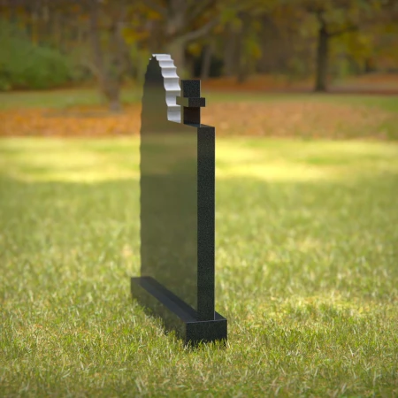 Religious headstones featuring Virgin Mary and cross for sacred memorials.