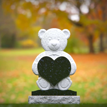 Blessed headstone near me engraved with child’s heart and teddy