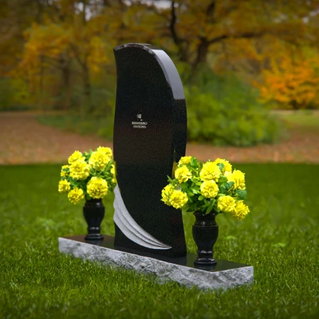 Elegant curved granite headstones with wave accents for timeless memorials.