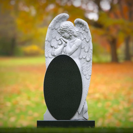 1861 - Angel Memorial Headstone with Carved Praying Figure and Oval Inscription Panel