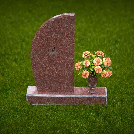 Contemporary headstones featuring sleek curves and floral vases.