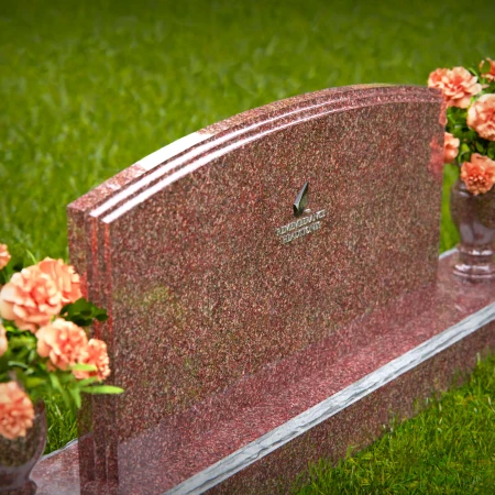 Dual vase headstones with arched design honoring shared memories.