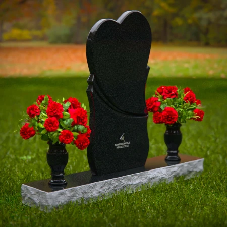 Unique dual heart headstones with twin flower vases for memorials.