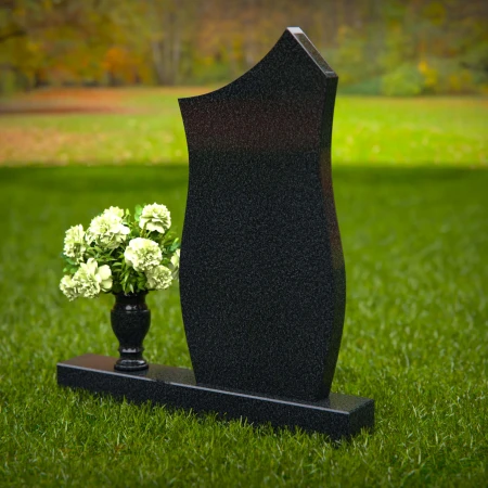 Modern contoured granite headstones with single flower vase.