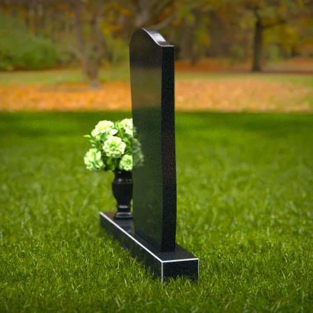 Elegant curved granite headstones with layered detailing for timeless memorials.