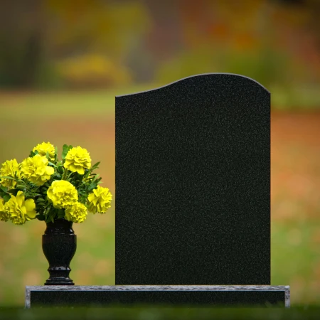 Elegant granite headstones with gently curved top and flower vase.