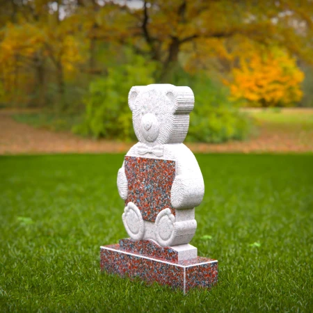 Sympathetic grave markers for kids featuring plaque-holding teddy