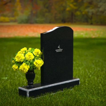 Elegant granite headstones with gently curved top and flower vase.