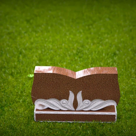 Elegant storytelling carved into this open book headstone prices