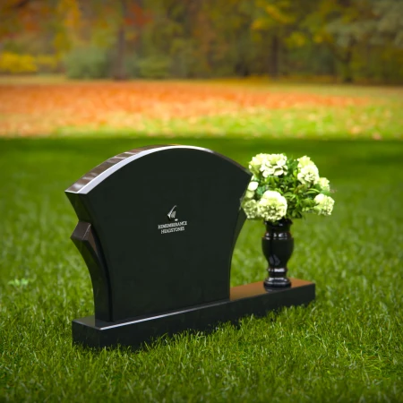 Unique headstones featuring artistic arch designs and floral vases.