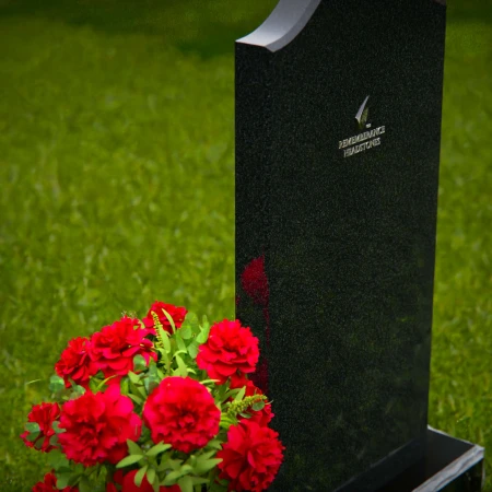 Classic upright headstones with flower vase for timeless memorials.