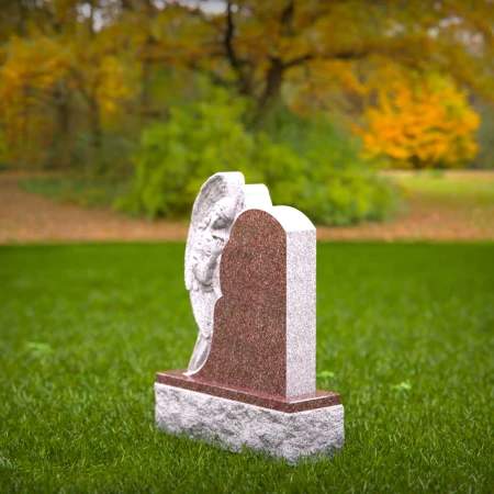 Graceful presence keeps memory alive through memorials, headstone, and grave ornaments.