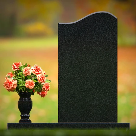 Curved granite headstones with elegant flower vase tribute.