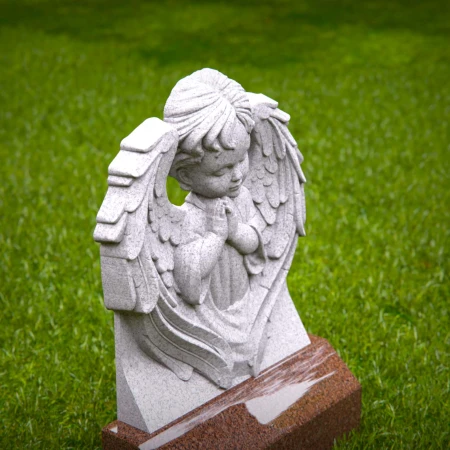 Reflective child tombstones carved with kneeling cherub angel